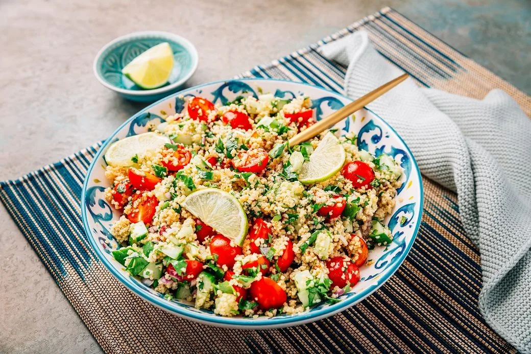 A Bowl Of Fresh Tabbouleh Salad With Chopped Tomat JBVLMU4