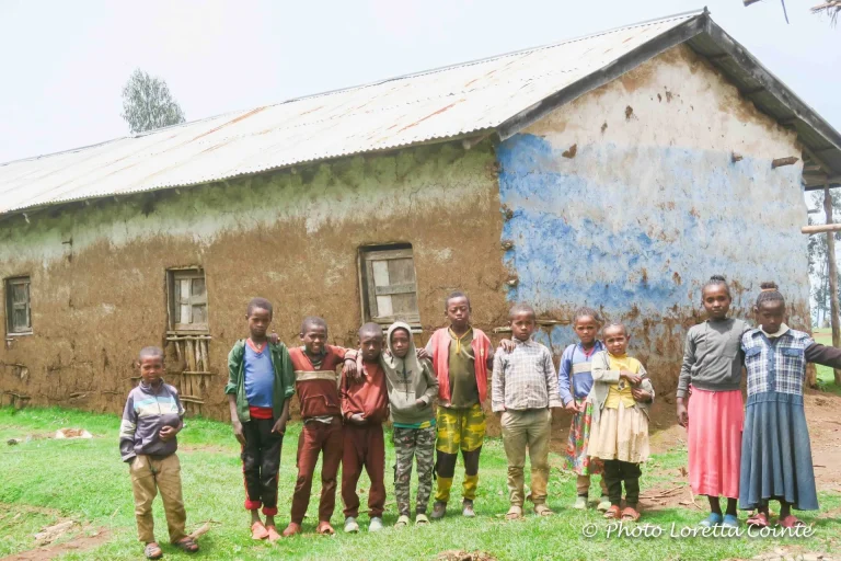 10- Shama Laka students in front of an old classroom block, still in use