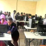 2 demeka hs students in computer class