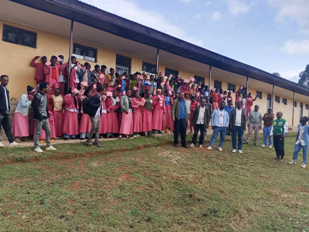 2 tulla students in front of new classroom block