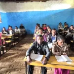 3 tulla high school students in existing classroom