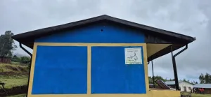 Inauguration du nouveau bâtiment scolaire de Tulla 7 h.e.l.p. logo on school block